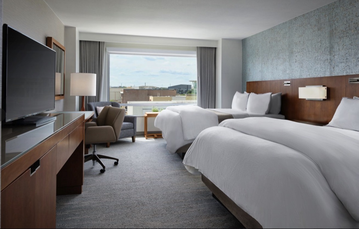 Guest room at The Westin Austin at The Domain with two queen beds and a view over The Domain
