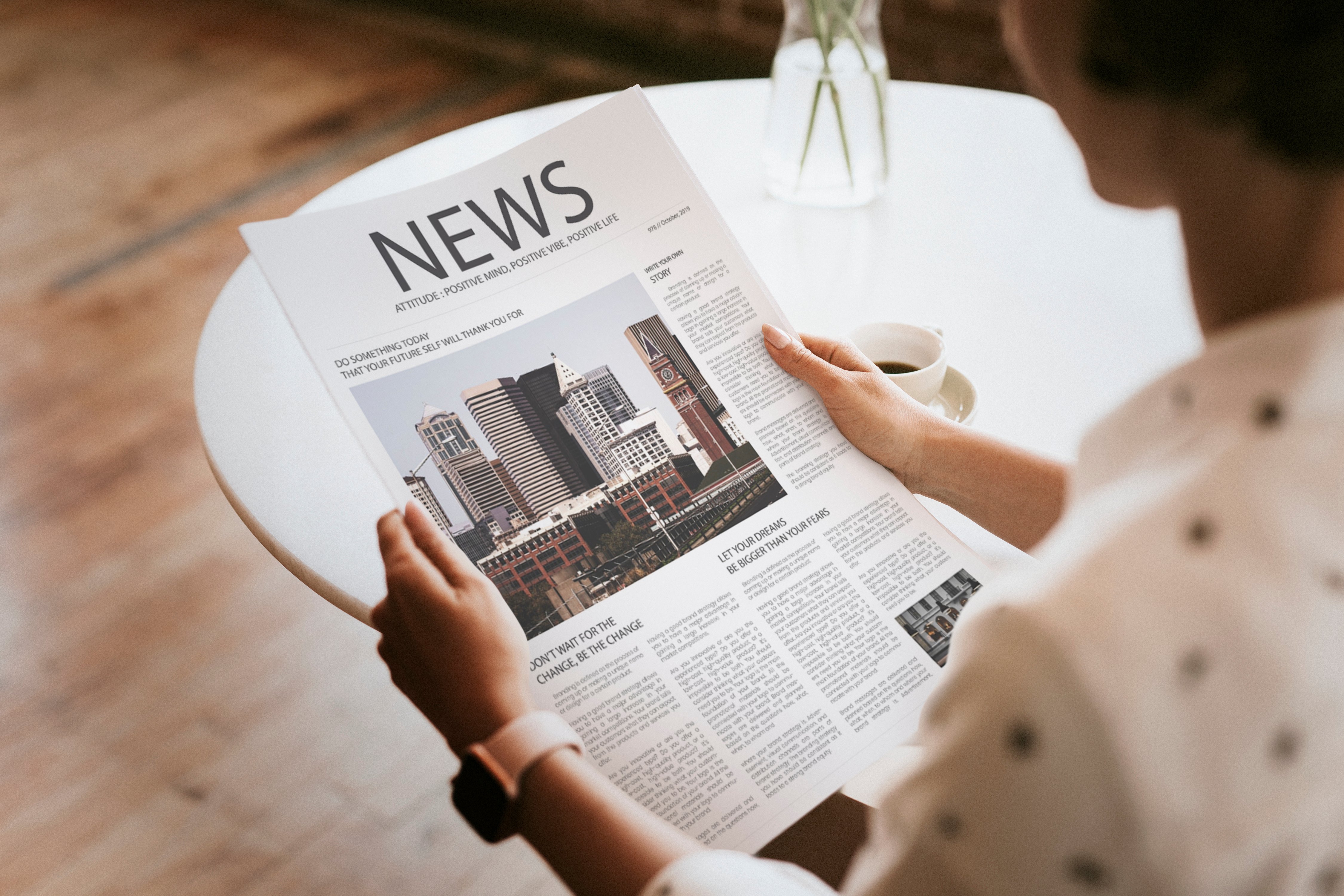 woman reading a newspaper