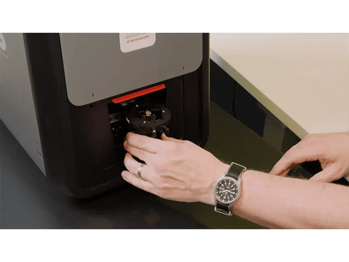 Man Putting a Bullet Holder in the Q3M 