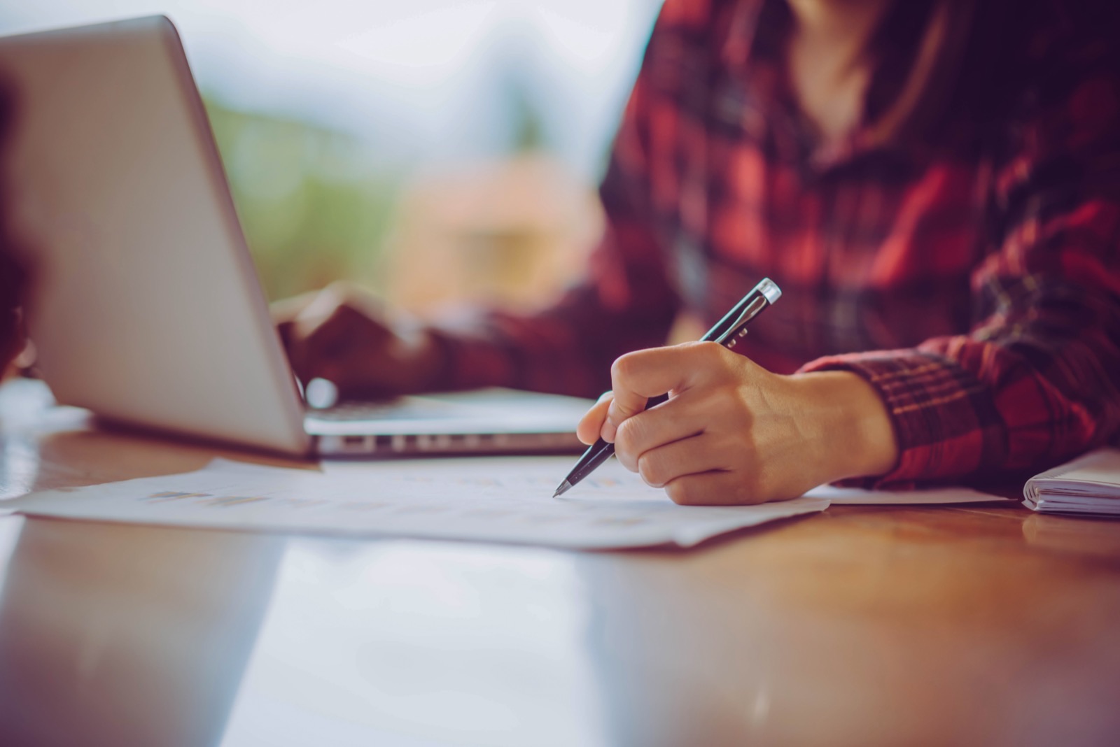 Person working on grant writing at a laptop
